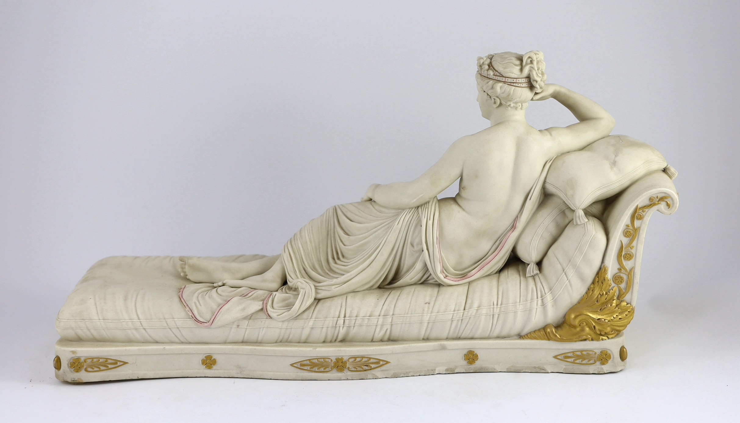 A Royal Worcester parian figure, after Antonio Canova, of Pauline Borghese as Venus Victorious, modelled by James Hadley, c.1866, 59.5cm long, some restoration to edge of base